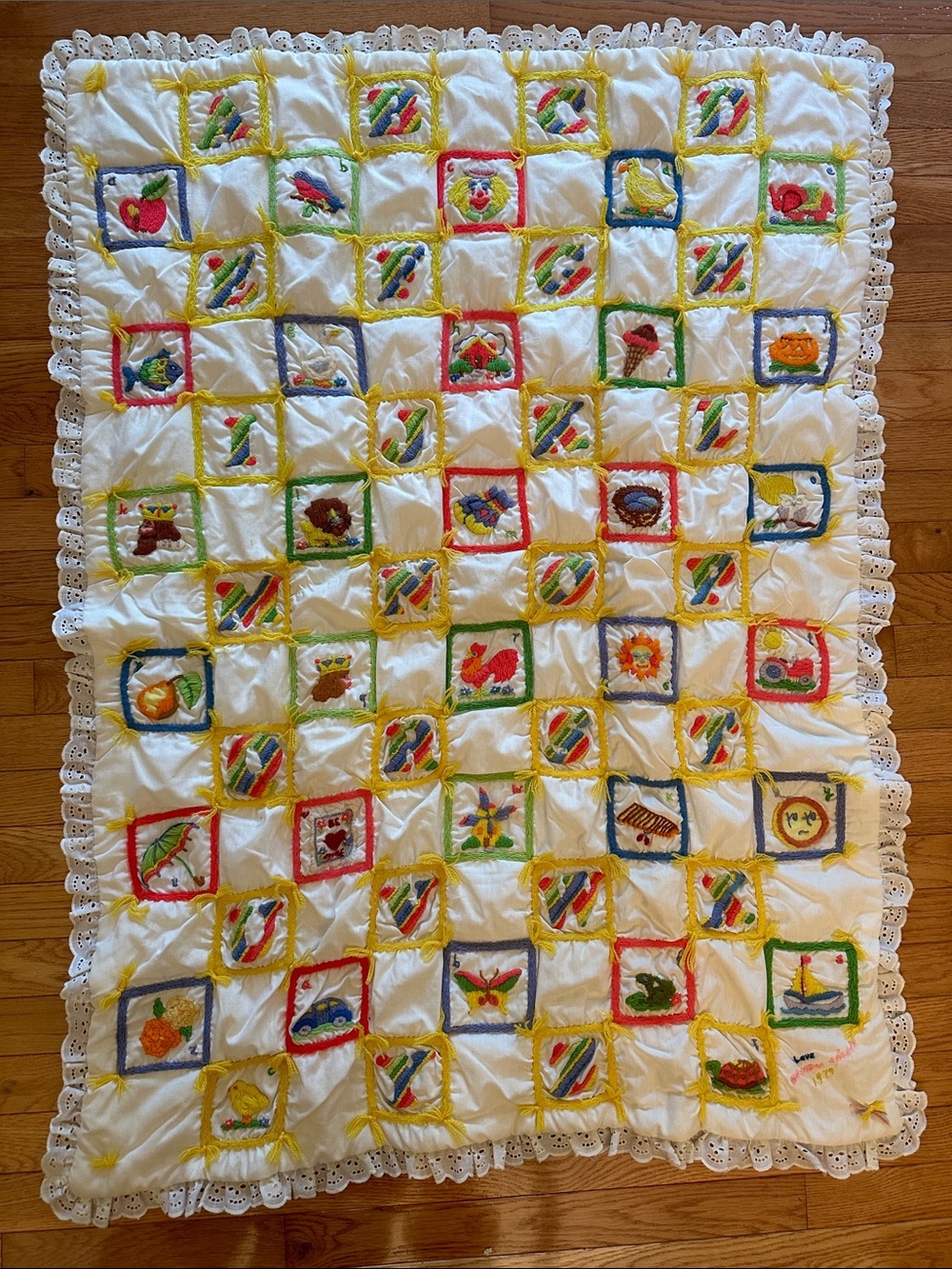 Handmade baby, toddler ABCs embroidered quilt with yellow gingham backing, 1979